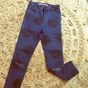 Slightly destroyed w/oversized polka dots.